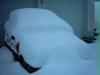 My car under heaps of snow